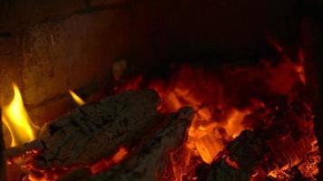 Smouldering coals in a fireplace. Slow motion video