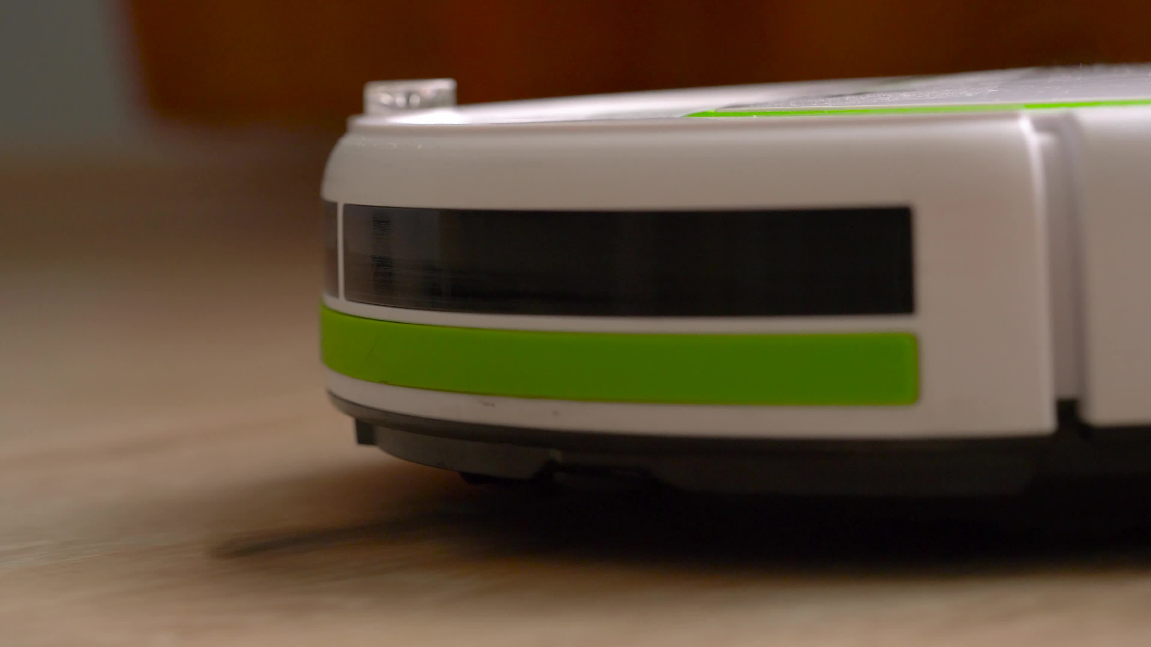 Vacuum cleaner robot that cleans a wooden floor 21926425 Stock Video at