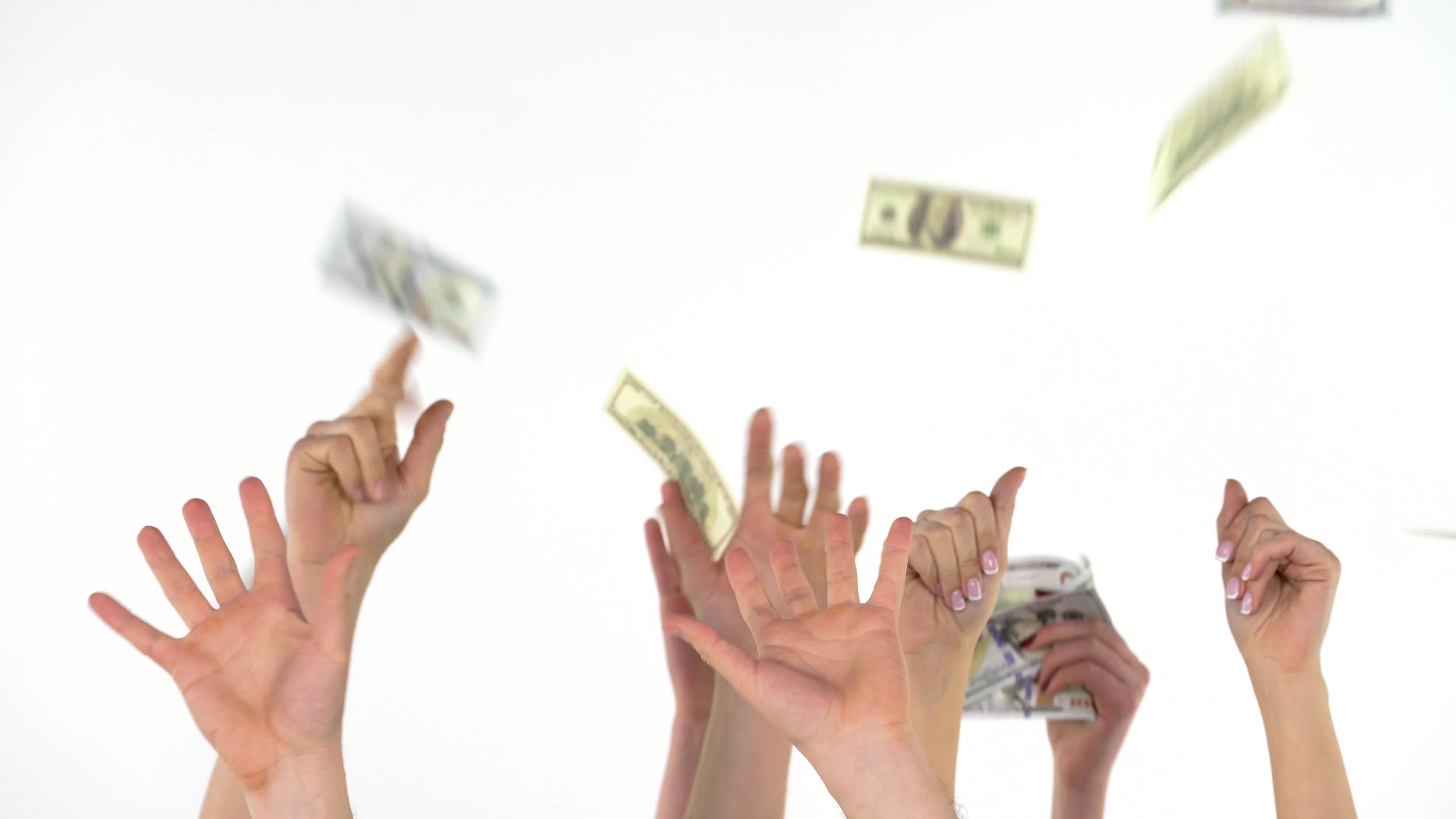 Many hands catch falling US dollars. Slow motion 21926434 Stock Video