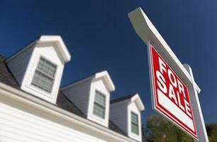 For Sale Real Estate Sign in Front of New House. photo