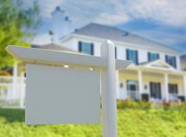 Blank Real Estate Sign in Front of New House. photo