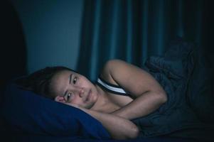 Asian women have a high concern that is why she can't sleep.Have stress from work photo