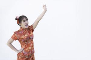 Portrait beautiful asian woman in Cheongsam dress,Thailand people,Happy Chinese new year concept,Happy  asian lady in chinese traditional dress photo