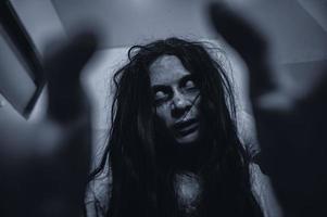 Portrait of asian woman make up ghost,Scary horror scene for background,Halloween festival concept,Ghost movies poster,angry spirit in the apartment photo