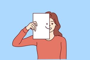 Happy woman covers half of face with paper with smiling emoticon, wanting to share good mood and positive with people around. Kind girl carelessly looks at camera enjoying life and enjoying moment vector