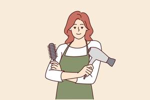 Woman professional hairdresser from barbershop holding comb and hair dryer to care for client hairstyle. Girl working as hairdresser in beauty salon stands with arms crossed and looks at camera vector