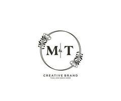 initial MT letters hand drawn feminine and floral botanical logo suitable for spa salon skin hair beauty boutique and cosmetic company. vector