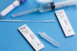 Positive test result by using rapid test device for COVID-19. photo