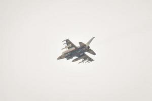 Abu Dhabi, UAE, 2023 - united arab emirates military fighter jet cross sky over Abu Dhabi photo