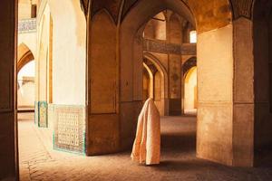 Kashan, Iran ,2022 - Tourists and pilgrims explore sightseeing beautiful Agha Bozorg Mosque photo