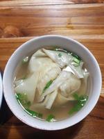 wonton soup that looks very fresh and tempting to eat. photo