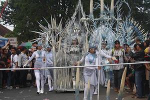 JEMBER, JAWA TIMUR, INDONESIA - AUGUST 25, 2015  jember fashion carnival participants are giving their best performance with their costumes and expressions during the event, selective focus. photo