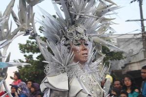 JEMBER, JAWA TIMUR, INDONESIA - AUGUST 25, 2015  jember fashion carnival participants are giving their best performance with their costumes and expressions during the event, selective focus. photo