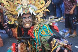 JEMBER, JAWA TIMUR, INDONESIA - AUGUST 25, 2015  jember fashion carnival participants are giving their best performance with their costumes and expressions during the event, selective focus. photo