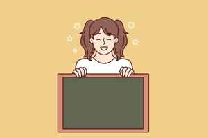 Little girl smiling demonstrates empty chalkboard designed for applying notifications or promotional offers. Preteen girl with advertising chalkboard advises to pay attention to space for text vector