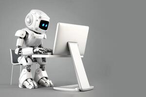 Smart white robot as AI chatbot sitting in front of computer typing. photo