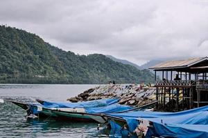 Fishing Boats rest at their moorings in the shelter. south of aceh, indonesia. photo