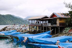 Fishing Boats rest at their moorings in the shelter. south of aceh, indonesia. photo