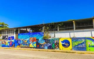 Puerto Escondido Oaxaca Mexico 2023 Wall with graffiti art drawings paintings in Puerto Escondido Mexico. photo