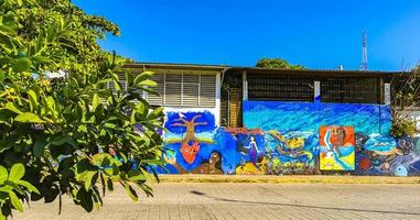 Puerto Escondido Oaxaca Mexico 2023 Wall with graffiti art drawings paintings in Puerto Escondido Mexico. photo