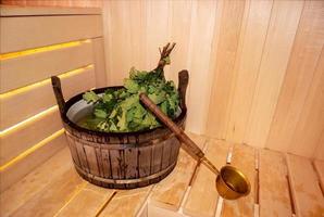 Finnish sauna interior, classic wooden sauna, Russian sauna, sauna accessories in a village bath. SPA concept photo