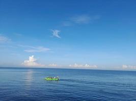 fishermen who are looking for fish around the coast photo