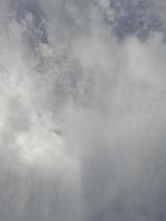 Beautiful clouds on deep blue sky background. Large bright soft fluffy clouds are cover the entire blue sky. photo