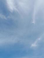 Beautiful white clouds on deep blue sky background. Large bright soft fluffy clouds are cover the entire blue sky. photo