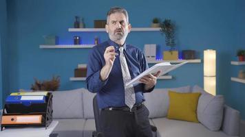 Thoughtful mature businessman thinking of creative and genius ideas. Mature businessman working in home office thinking, happy and cute mature man thinking about creative ideas. video
