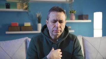 Man with sore throat can't swallow, goiter. A man with a swollen and irritated close throat. video