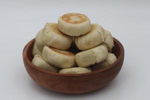 a close up of Bakpia served in a wooden bowl photo