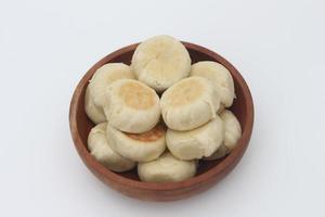 a close up of Bakpia served in a wooden bowl photo