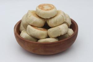 a close up of Bakpia served in a wooden bowl photo