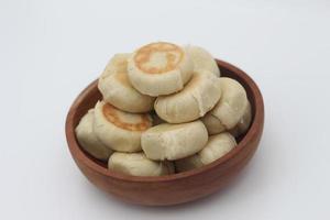 a close up of Bakpia served in a wooden bowl photo