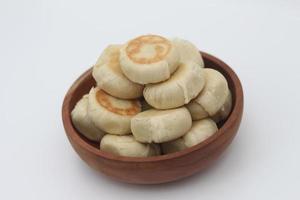 a close up of Bakpia served in a wooden bowl photo