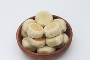 a close up of Bakpia served in a wooden bowl photo