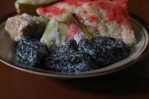 sengkulun, cenil, and getuk served on a plate and ready to eat. photo