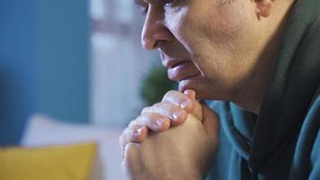 Man in panic feeling worried thoughtful and helpless. Close-up of man looking worried and overwhelmed, panicking, closing his eyes, helpless and weak. video