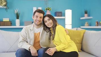 Portrait of a happy and cheerful young couple or two lovers at home. video