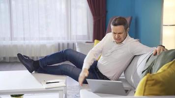 Frustrated businessman getting angry at home, shouting, bored with work. Mature businessman who is having trouble and getting overwhelmed with work becomes aggressive, depressed, stressed. video