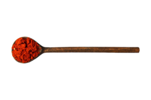 Wooden spoon with red condiments isolated on a transparent background png