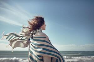 striped scarf being blown by the sea breeze, photo