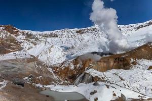 Fumaroles in the crater volcano photo