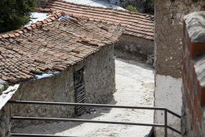 Typical rural landscape and peasant houses in the village. Old houses in the old town photo