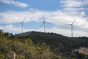 Wind turbines on the mountain. Wind turbines on blue sky. photo