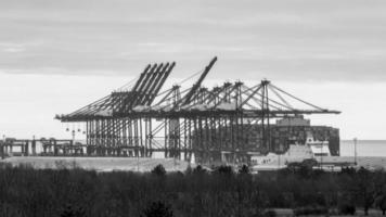 Container ship being loaded photo