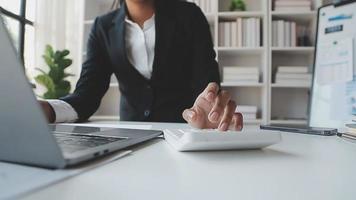 Financial analysts analyze business financial reports on a digital tablet planning investment project during a discussion at a meeting of corporate showing the results of their successful teamwork. video