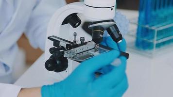 Medical Science LaboratoryPortrait of Beautiful Black Scientist Looking Under Microscope Does Analysis of Test Sample. Ambitious Young Biotechnology Specialist, working with Advanced Equipment video