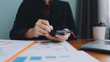 Financial analysts analyze business financial reports on a digital tablet planning investment project during a discussion at a meeting of corporate showing the results of their successful teamwork. video