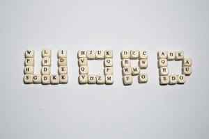 Wood cubes with letters word alphabet text background photo